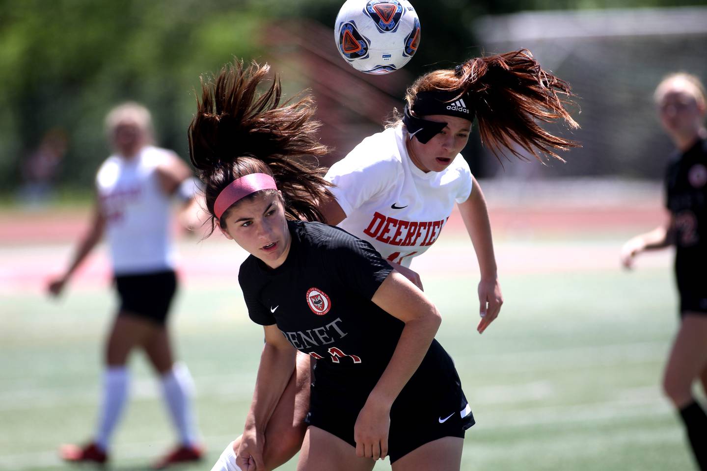 Benet’s Gabi DiMatteo (left) and Deerfield’s Jessie Fisher head the ball during an IHSA Class 2A state semifinal game at North Central College in Naperville on Friday, June 3, 2022.