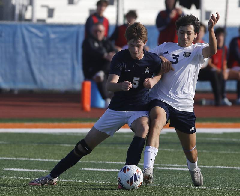 Belleville Althoff Catholic's Luke Smith tries to knock Lemont's Vincenzo Mancini off the ball during an IHSA Class 3A state semifinal soccer match on Friday, Nov. 8, 2024, at Hoffman Estates High School.