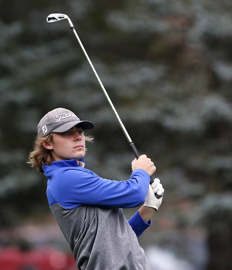 Dundee-Crown’s Jared Russell watches his tee shot on the 18th hole during the Fox Valley Conference Boys Golf Tournament Thursday, Sept. 21, 2023, at McHenry Country Club in McHenry.