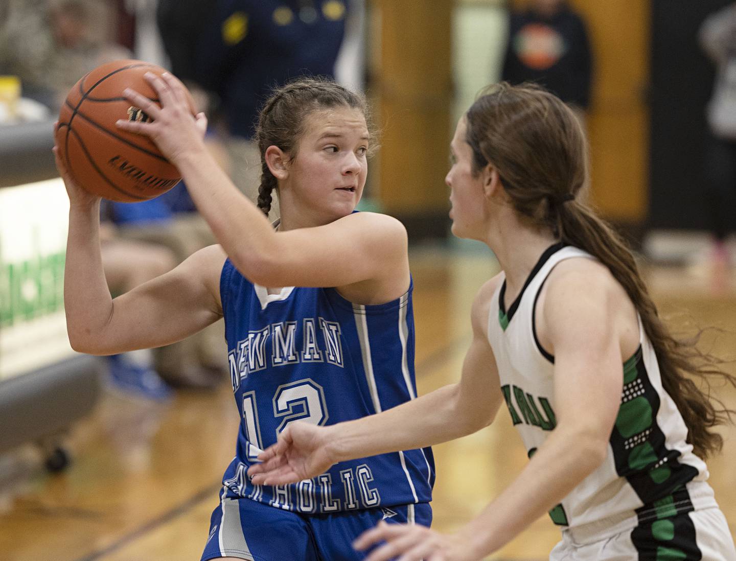 Newman’s Lucy Oetting looks to pass against Rock Falls Thursday, Nov.17, 2022.