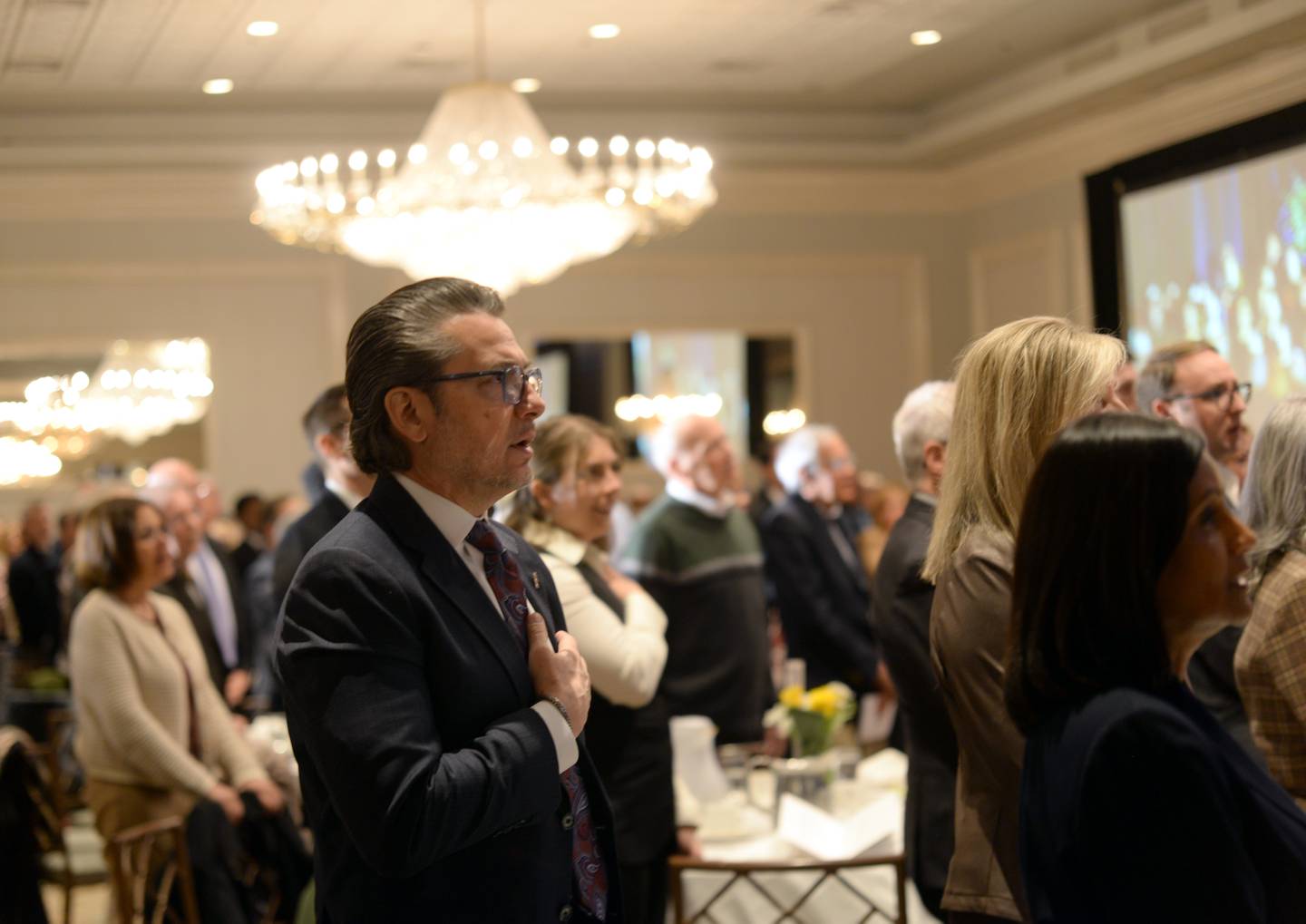 Inland Real Estate CEO Tony Chereso of Wheaton recites the Pledge of Allegiance during the 3rd annual Dr.Martin Luther King Jr. Unity Breakfast in Oakbrook Terrace