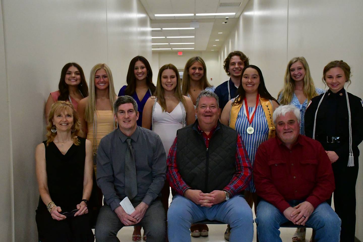 Hall High School board members (front, left to right) Teresa Colmone, Rich Savitch, Mike Morris and John Picatto take a photo with students (middle, left to right) Molly Dalzot, Mia Mautino, Jasmine Valadez-Castaneda, Victoria Ullrich (back, left to right) Mia DeAngelo, Reese McDonald, Kierra Wozniak, Aidan Jones and Elizabeth Wenzel.