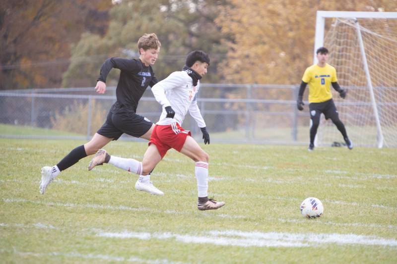 South Elgin's Pelon Munoz advances the ball down field part St. Charles North's Carter Notebaert at the Class 3A Sectional Final on Saturday, Nov. 1,2025 in South Elgin.