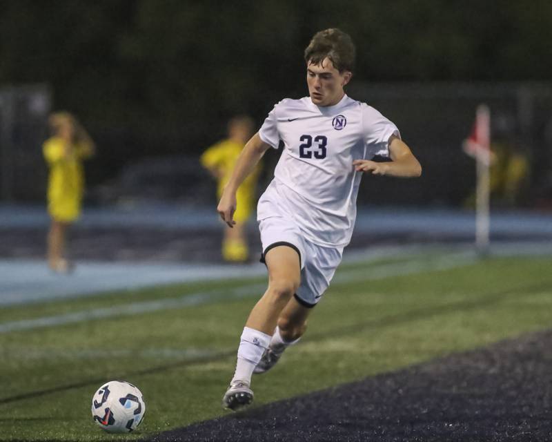 Downers Grove North's Dylan Graham (23) advances the ball during soccer match between Downers Grove North at Downers Grove South. Oct 2, 2025.