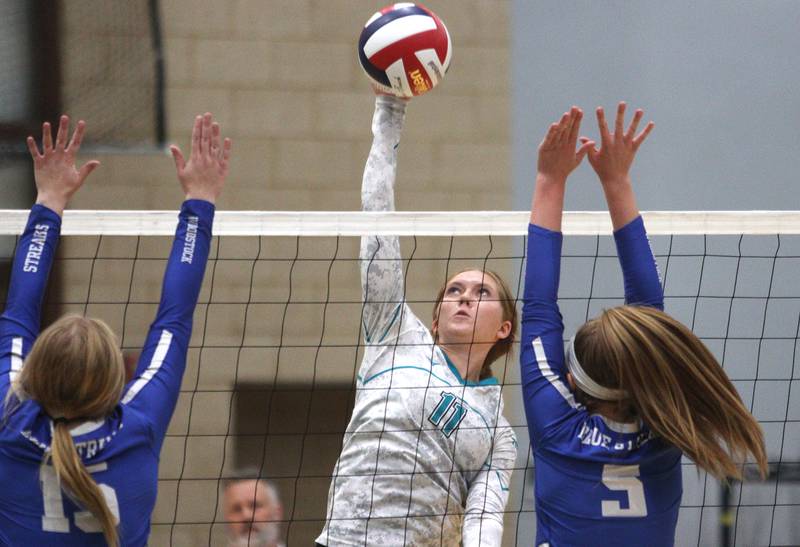 Woodstock North’s Lexi Hansen hits the ball against Woodstock in varsity volleyball at Woodstock North Monday night.