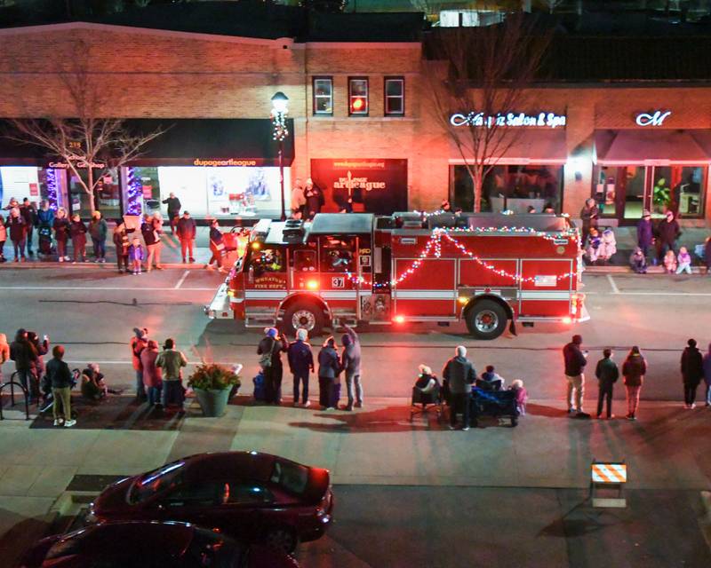 A Wheaton fire engine kicks off the Wheaton Holiday Parade in downtown Wheaton on Friday Nov. 24, 2023.