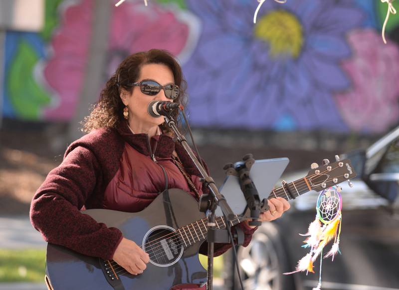 Suzy Schwartz of Marengo performs during the last day of the Glen Ellyn French Market Sunday, Oct. 20, 2024.