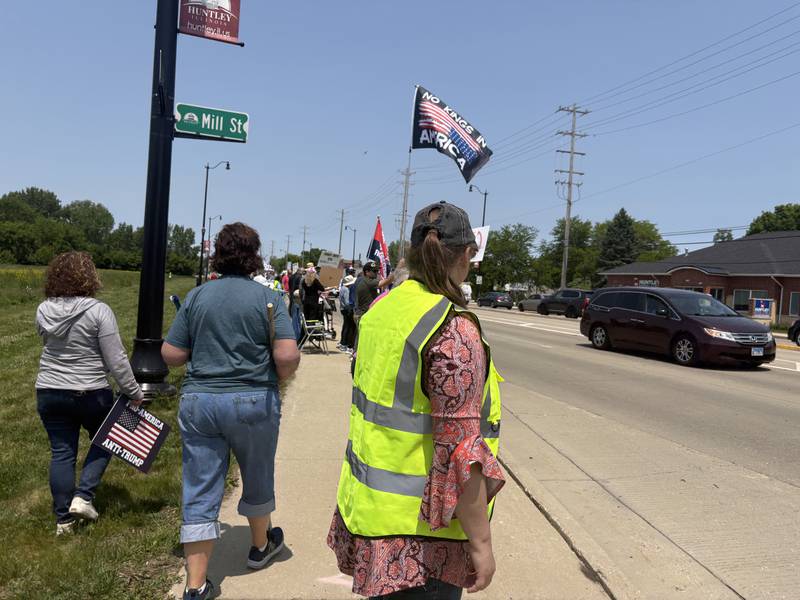 People rally against President Donald Trump in Huntley May 31, 2025.