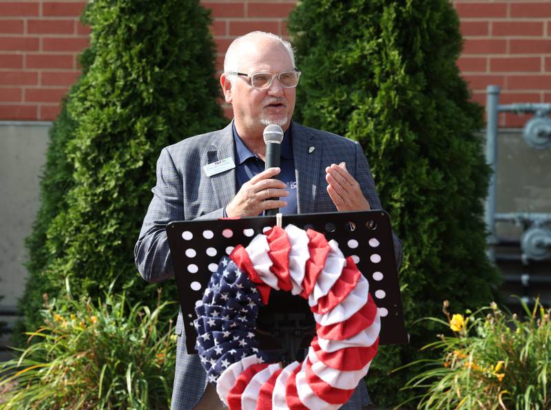 Brad Hoey, Chair of the DeKalb Citizens’ Community Enhancement Commission, introduces speakers Thursday, Aug. 22, 2024, during the DeKalb Veterans Memorial Mural dedication in Van Buer Plaza in downtown DeKalb.