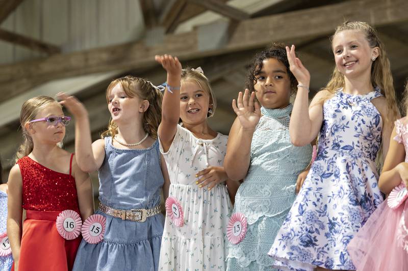 Little Miss Ogle County contestants wave from the stage Thursday, July 30, 2025, at the Ogle County Fairgrounds.
