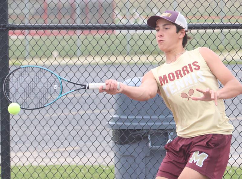 Morris's Andrew Ochoa returns a serve during the Class 1A Sectional tennis meet on Friday, May 22, 2026 at the La Salle-Peru Township High School Athletic Complex in La Salle.