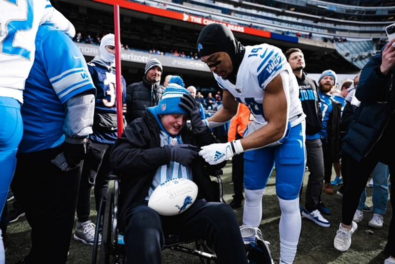 Detroit Lions wide receiver Amon-Ra St. Brown visits with Huntley's Lucas Gidelski before the Lions faced the Chicago Bears on Sunday, Nov. 13, 2022, at Soldier Field in Chicago.