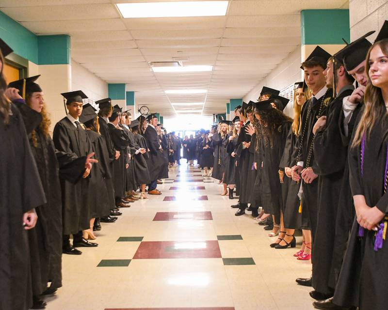 Sycamore graduates’ line the hallway before making their way into the fieldhouse on Sunday May 24, 2026, for the graduation ceremony held at Sycamore High School.