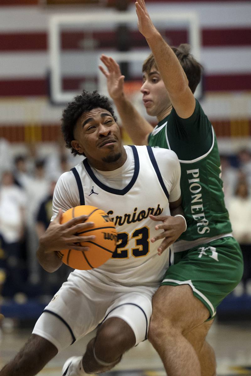 Sterling’s Kaedon Phillips works against Alleman’s Jack Wendt Friday, Dec. 20, 2024, at Sterling High School.