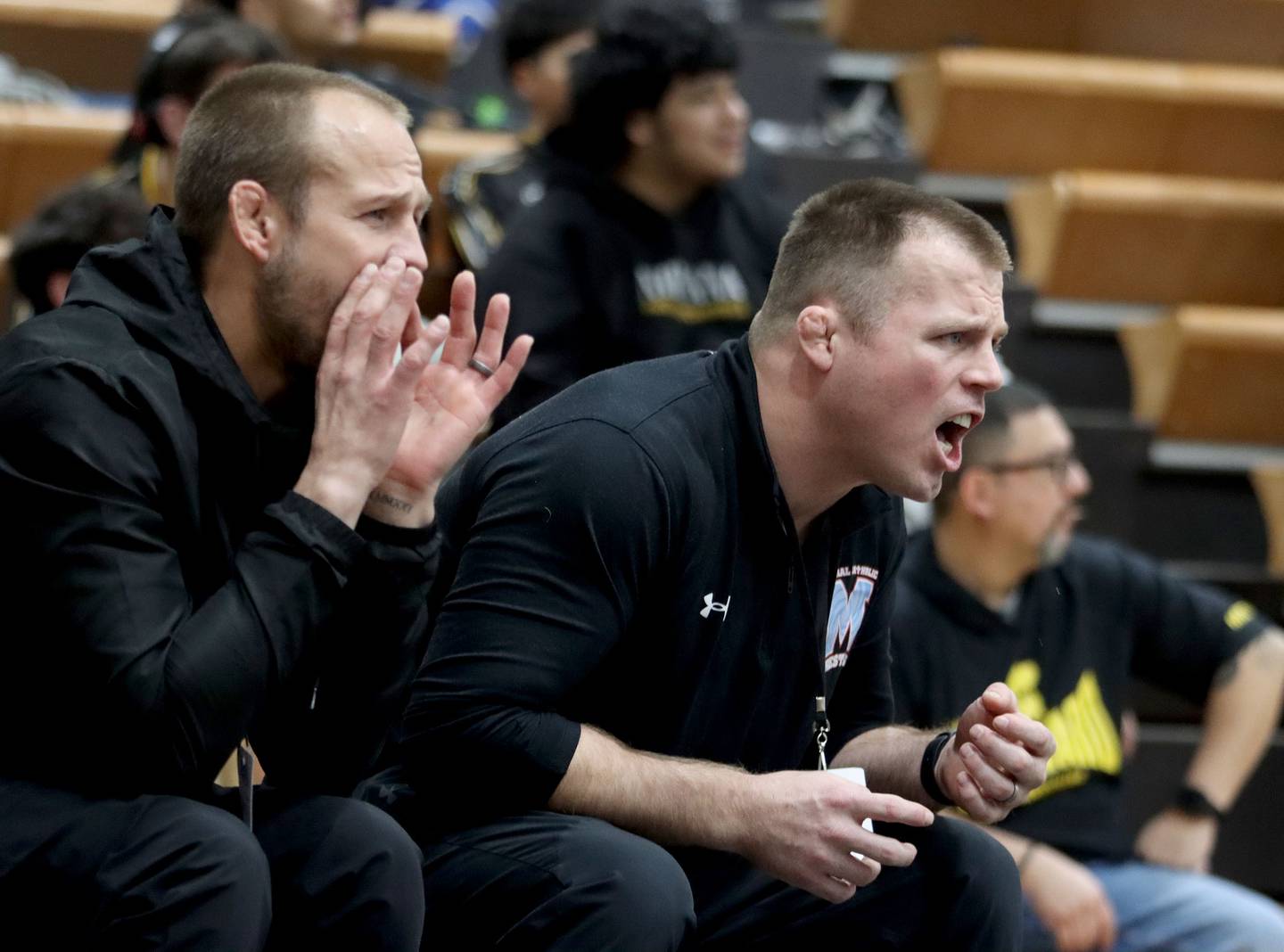 Marian Head Coaches Jordan Blanton, right, and Ryan Prater guide the Hurricanes in boys wrestling IHSA Class 2A Regional action on Saturday, Jan. 31, 2026, at Harvard High School in Harvard.