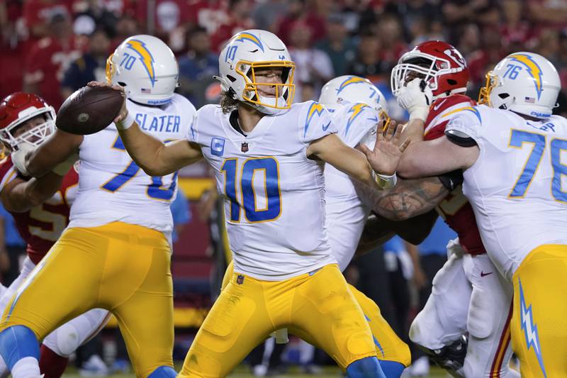 Los Angeles Chargers quarterback Justin Herbert (10) passes against the Kansas City Chiefs during an NFL football game Thursday, Sept. 15, 2022, in Kansas City, Mo. (AP Photo/Ed Zurga)