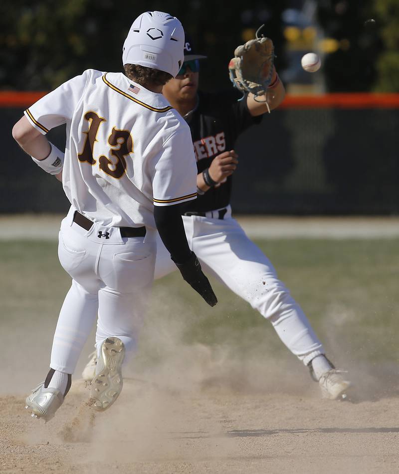 Crystal Lake Central's Jaden Obaldo catches the ball to force Jacobs’ Brandon Koth out a second base during a Fox Valley Conference baseball game Monday, April 10, 2023, at Crystal Lake Central High School.
