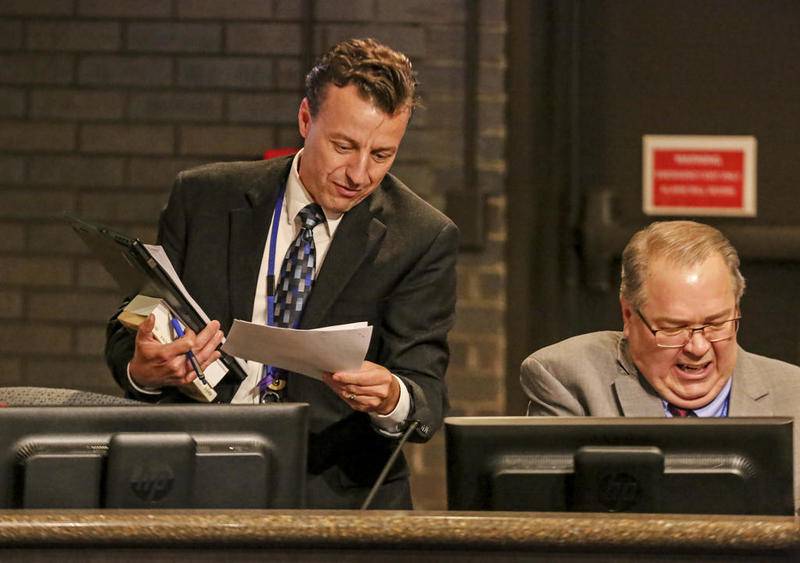 Marty Shanahan speaks to former city manager David Hales (right) Oct. 2 at Joliet City Hall.