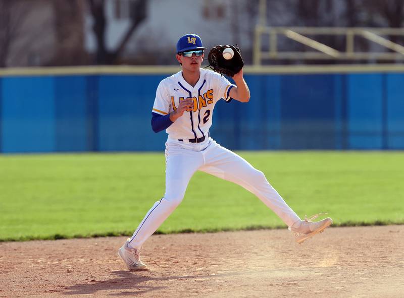 Lyons Township's Michael Mango (2) catches the ball during the boys varsity baseball game between Lyons Township and Downers Grove North high schools in Western Springs on Tuesday, April 11, 2023.