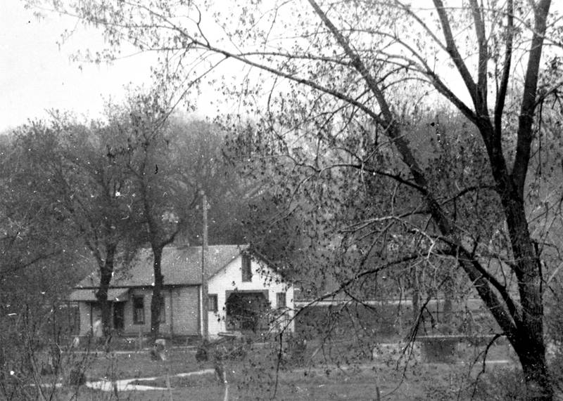 Built in April 1870 by Asahel Newton, this commercial structure was used for a number of industrial purposes before Rush Walker turned the building into a steam-powered gristmill in October 1885. Previous uses had included an apple cider mill (October 1871); wooden ware manufacture, including hand pumps (April 1873); Marshall patent windmills manufactured under license (June 1874); the original Richards rolling door hardware, later Richards-Wilcox (September 1879); and cotton batting (October 1880). In February 1885, Rush Walker converted the building into a steam-powered livestock feed grinding mill. By October of that year, Oswego storekeeper David M. Haight had taken over the feed mill operation. It was last used as a feed mill by Fred Hage, who closed it sometime prior to the spring of 1891. But already by that time, the north half of the building was being used as a dwelling. The feed grinding equipment still occupied the south half of the building, and the steam engine was located in a shed added to the west side of the south half of the building. When the 1898 Sanborn Map of Oswego was published, it showed the engine shed and engine were still attached to the building and the grinding equipment still occupied half the main structure. Sometime before the spring of 1905 the engine shed was removed and the entire remaining building was remodeled into a private residence. That use, including the addition of a second story in the 1980s, has continued to the present.