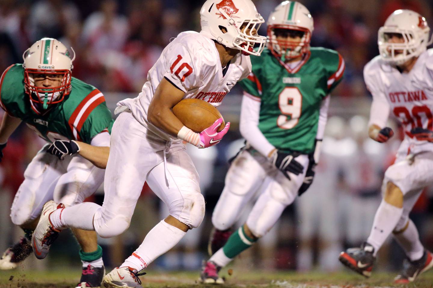 Ottawa's Michael Hermosillo (10) runs the ball up field as La Salle-Peru's Billy Vickers (9) gives chase in the 2012 contest at Howard Fellows Stadium.