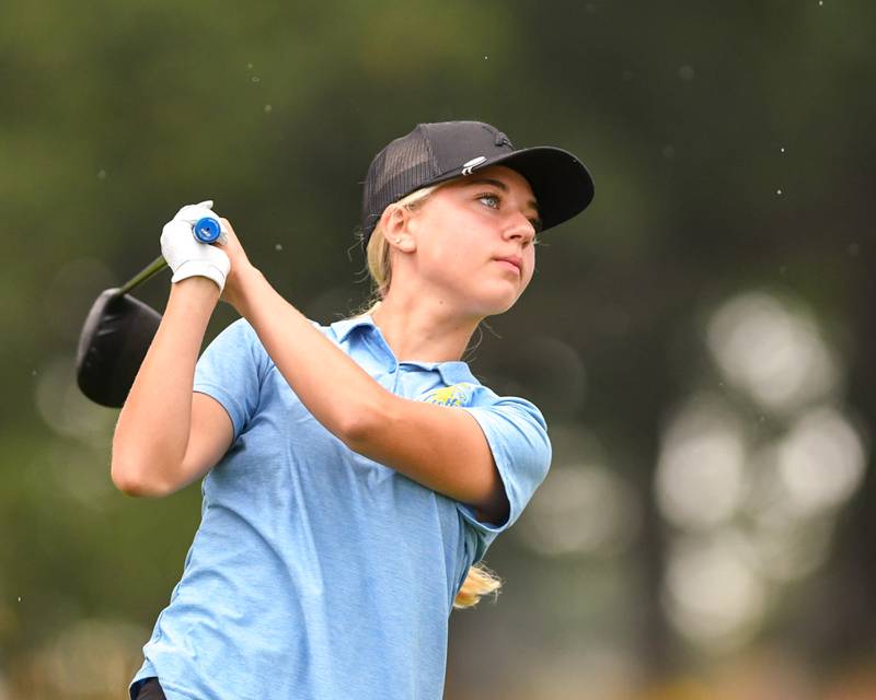Ariana Savenok of Wheaton North watches her ball in flight after teeing off during the DuKane conference meet on Tuesday Sept. 23, 2025, held at Phillips golf course in Aurora.