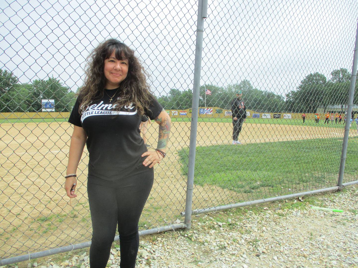 Lisa Martinez, president of the Belmont Little League, stands outside the batting cage at the league ballpark in Joliet. June 14, 2025