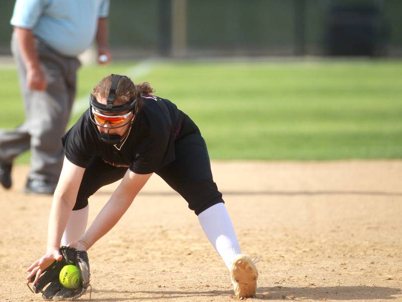 Montini’s Cedona Barrett scoops up a ground ball during a Class 3A Benedictine Supersectional against St. Laurence on Monday, June 9, 2025 in Lisle.