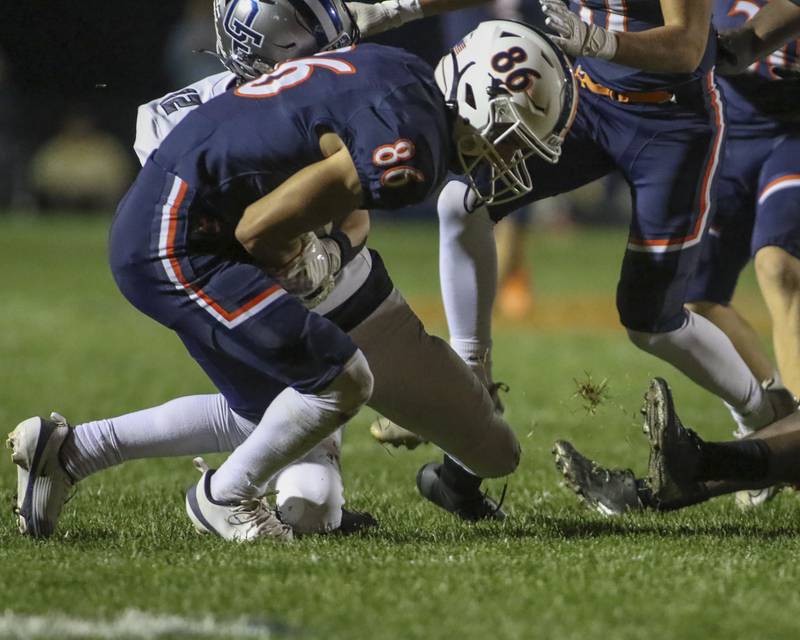 Oswego's Jesse Gilkerson (86) recovers a fumble off of an onside kick during football game between Oswego East at Oswego Friday, Oct 17, 2025 in Oswego.