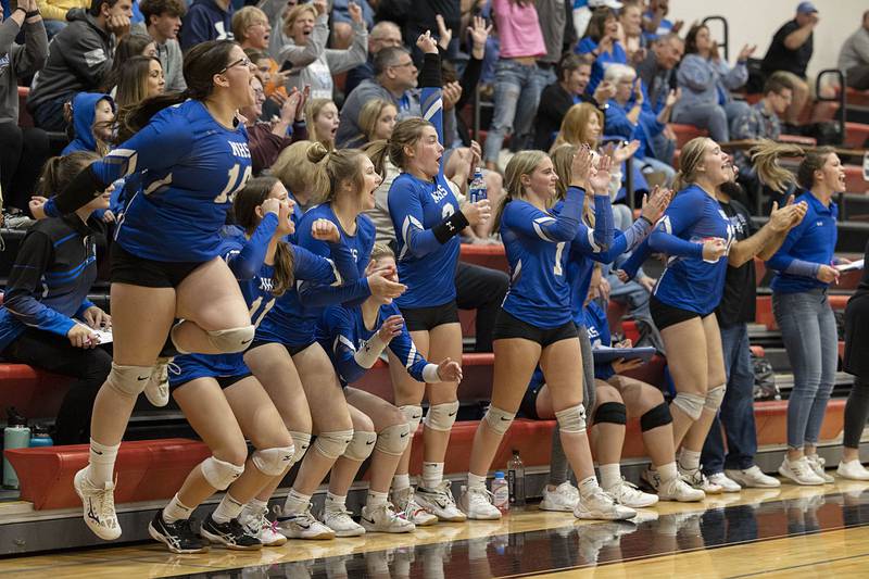 The Newman bench celebrates a game one win in the sectional semifinal Monday, Oct. 31, 2022 against Newark.