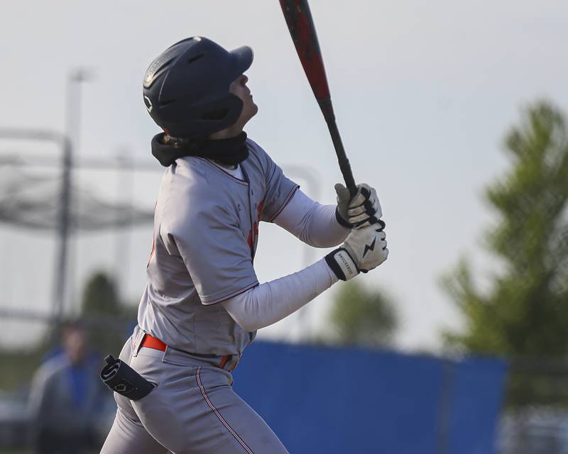 Oswego's Donny Williams (15) follows his fly ball to left during baseball game between Oswego East at Oswego. Monday, May 19, 2025 in Oswego.