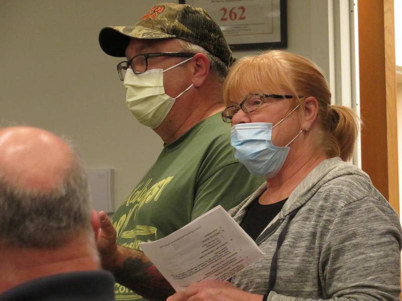 Jon and Rita McNatt, of the 200 block of South Fifth Street in DeKalb, talk about their new support for the most recent development project by John Pappas during the Monday DeKalb City Council meeting at DeKalb Public Library.