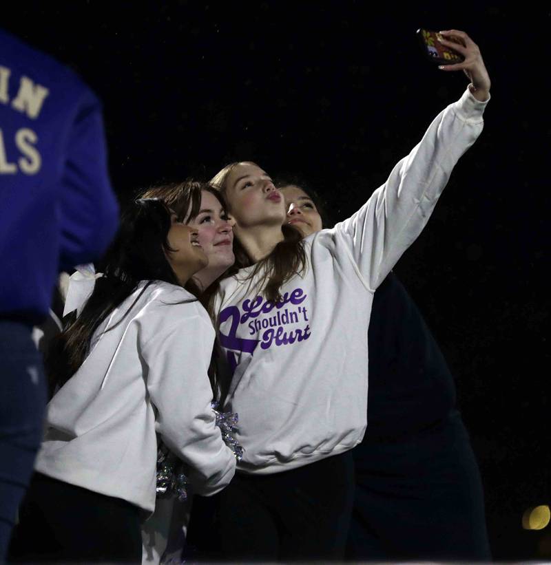 A group of Larkin dancers take a selfie during the annual crosstown rival game at Memorial Field  Friday October 14, 2022 in Elgin.