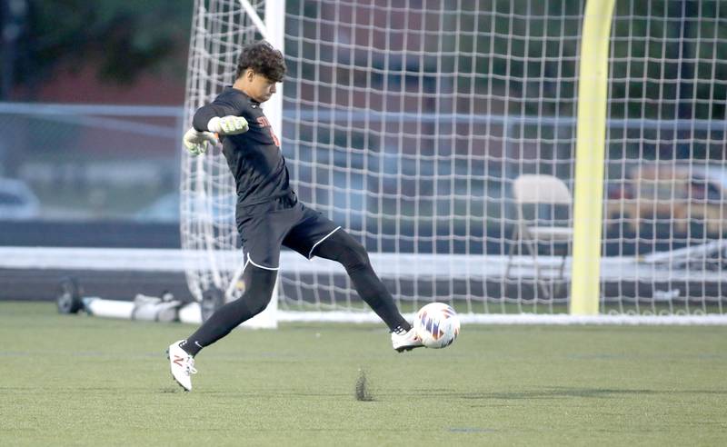 St. Charles East goalkeeper Jordan Rolon stops the ball during a game against Crystal Lake Central at Streamwood on Tuesday, Sept. 12, 2023.