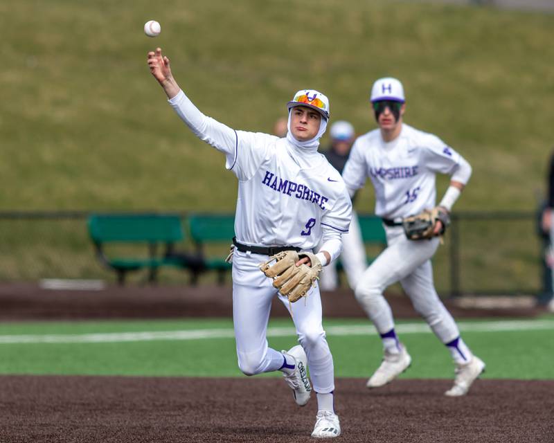 Hampshire's Jack Perrone (9) throws to first base during baseball game between Dixon at Hampshire.  March 28, 2024