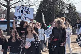Oswego East H. S. students walk out of school Friday to protest actions of ICE agents