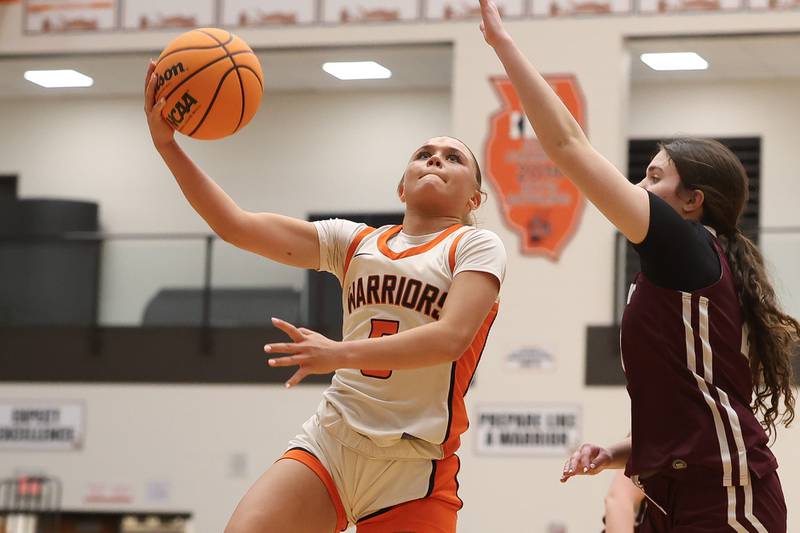 Lincoln-Way West’s Ava Tisch lays in a shot against Lockport on Tuesday, Feb. 3, 2026 in New Lenox.