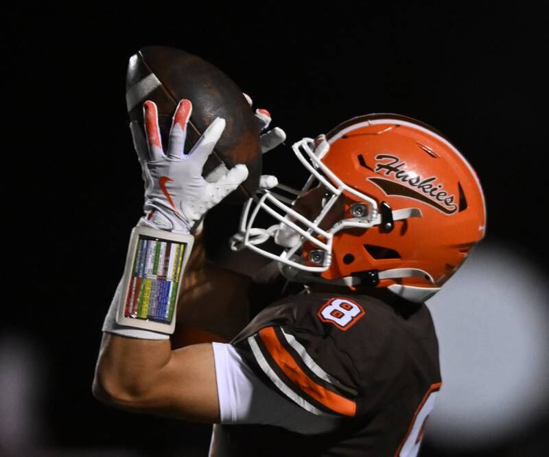 Hersey’s Luke Casey catches a pass for a touchdown on the Huskies’ second play from scrimmage during a football game against Rolling Meadows on Friday, Oct. 18, 2024 in Arlington Heights.