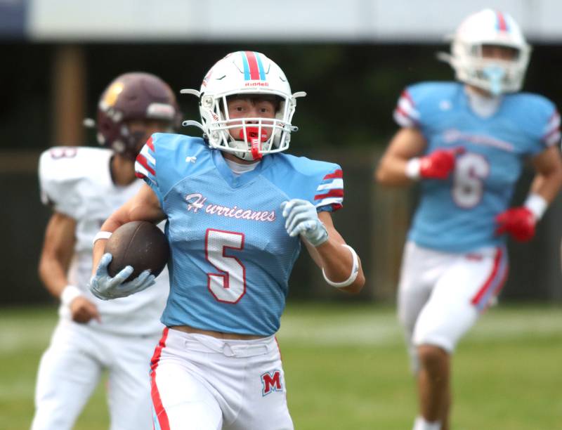 Marian Central’s Mike Schmid runs the ball against Richmond-Burton in varsity football at George Harding Field on the campus of Marian Central High School in Woodstock on Friday, August 29, 2025.