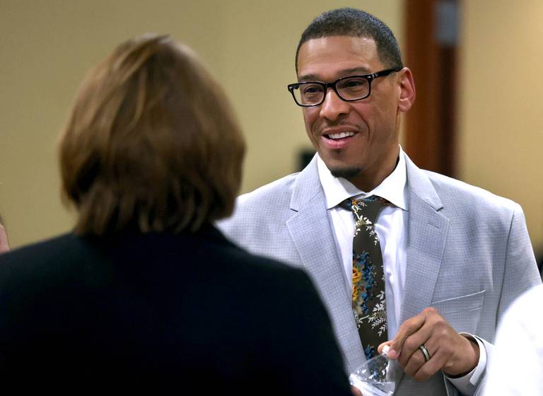 John Walker, current DeKalb 7th Ward Alderman and candidate for mayor, talks to attendees Wednesday, Feb. 19, 2025, at the DeKalb Area Rental Association and DeKalb Area Builders Association Candidate Night at Faranda's Banquet Center in DeKalb.