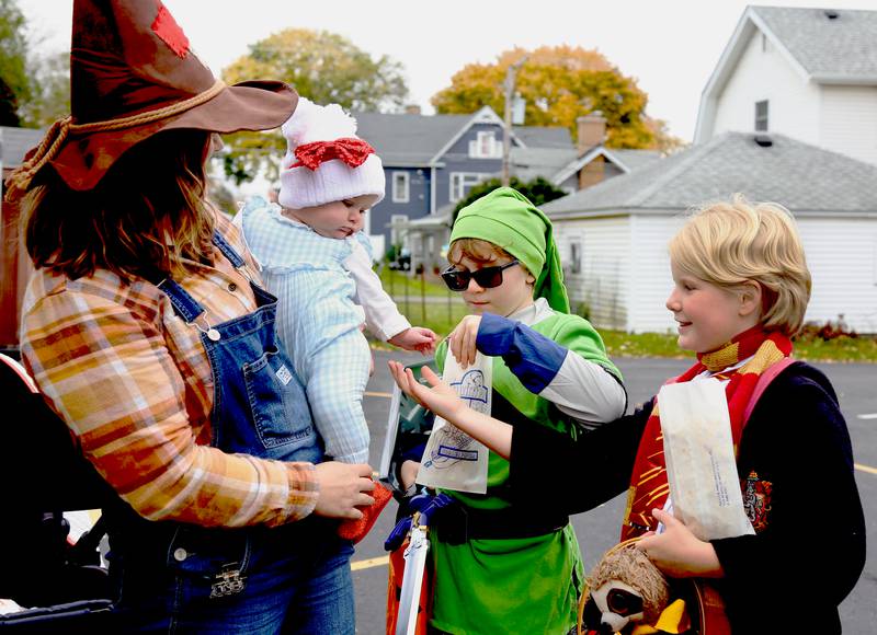 Lauren and Charlotte Biddle (left) mingle with Graham Butler, 8 and Lily Ray, 9 at the 9th Annual Trunk or Treat at the Elburn Community Congregational Church on Sunday, Oct. 29, 2023 in Elburn.