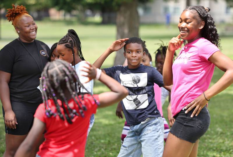 Campers and councilors have some fun during Camp Power at Welsh Park in DeKalb. Camp Power, which is run by the Kishwaukee Valley YMCA, is a summer program for youth at University Village that provides positive activities for kids.