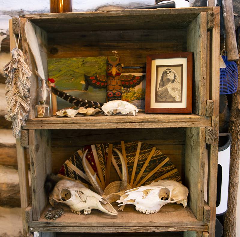 Tim Bendict's cabin is decorated with items that are carry on the history and nature of the area.