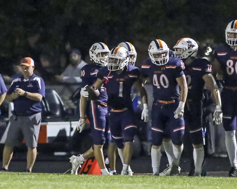 Oswego's Teddy Manikas (1) celebrates a touchdown catch and run during football game between Bolingbrook at Oswego Friday, Sept 12, 2025  in Oswego.
