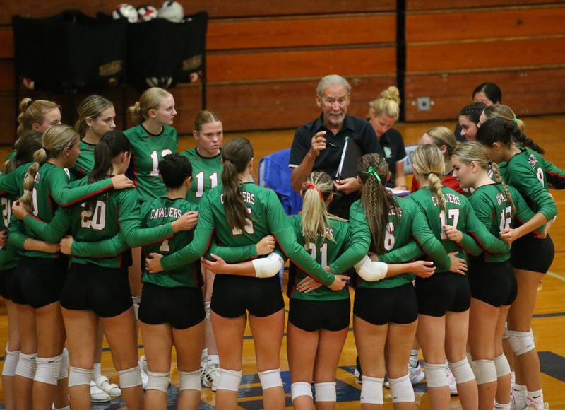 L-P head volleyball coach Mark Haberkorn talks to his team during a timeout on Tuesday, Aug. 27, 2024 at Princeton High School.