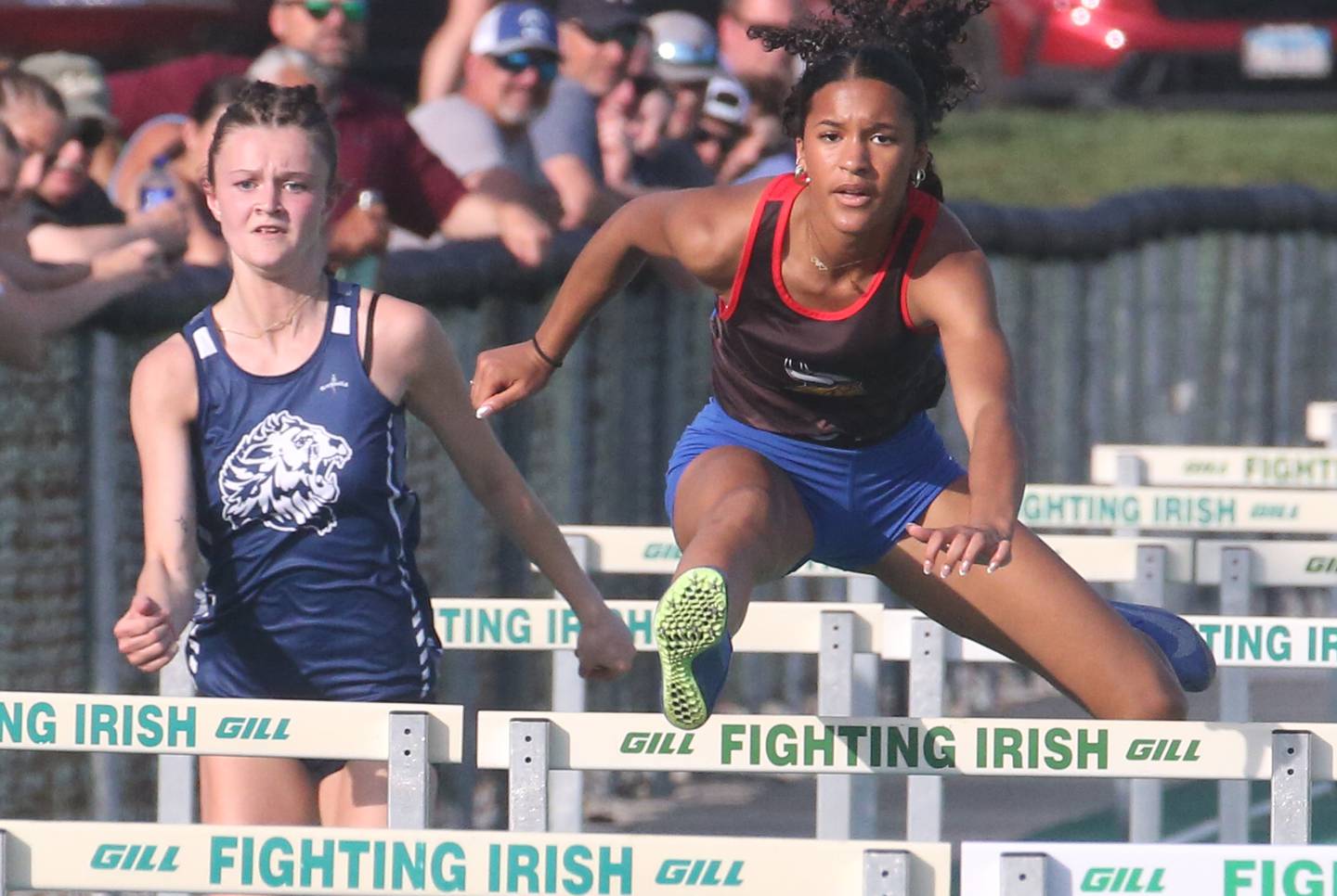 Lisle's Riley Ryan and Newark's Kyla Wesseh compete in the 100 meter hurdles during the Class 1A Sectional track meet on Thursday, May 15, 2025 at Seneca High School.
