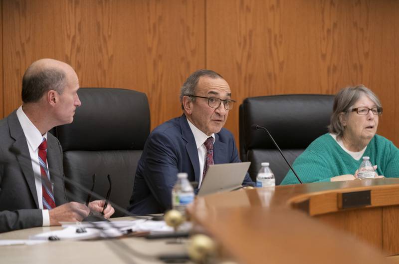 Crystal Lake Mayor Haig Haleblian, center, along with Electoral Board attorney Ken Florey, left, and councilwoman Cathy Ferguson, speaks during a hearing of the Crystal Lake Municipal Officers Electoral Board for hearing and passing upon of objections to nomination papers for candidates for Mayor and City Council at City Hall on Thursday, December 15, 2022.   Ryan Rayburn for Shaw Local