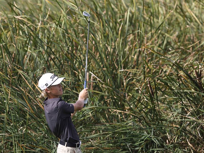 Kaneland’s Dylan Pjesky watches his fairway shot on the seventh hole during the IHSA Class 2A Crystal Lake South Boys Golf Regional on Wednesday, Oct. 1, 2025 at RedTail Golf Club in Lakewood.