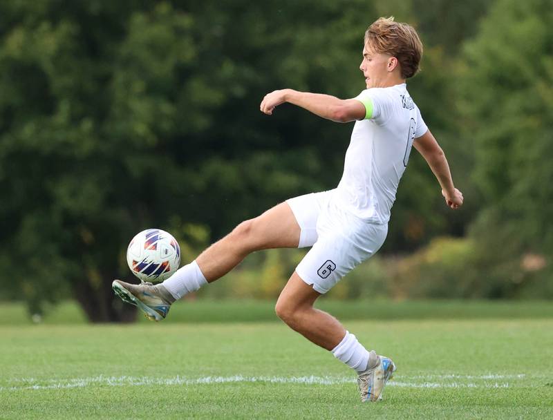 Kaneland's Noah McKittrick kicks the ball out of the air during their game Monday, Oct. 6, 2025, at Sycamore High School.