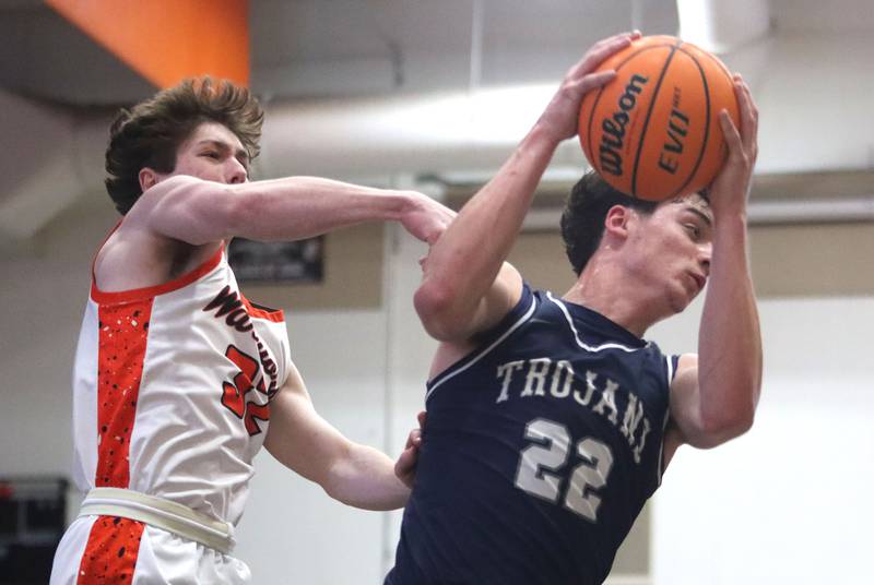 McHenry’s Garet Lobbins, left, battles Cary-Grove’s  Adam Bauer for the ball in varsity boys basketball on Tuesday, Feb. 17, 2026, at McHenry High School in McHenry.